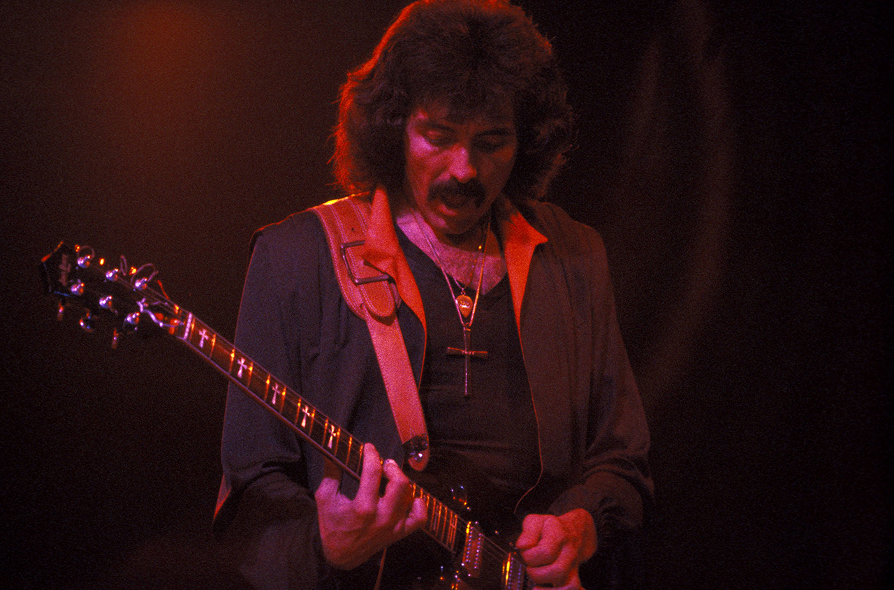 Iommi performing live onstage at Gaumont in 1980