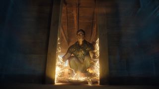 Chris Smith squatting down and looking up as the Quantum Unfolding Chamber door is relocated in Peacemaker season 2 episode 4