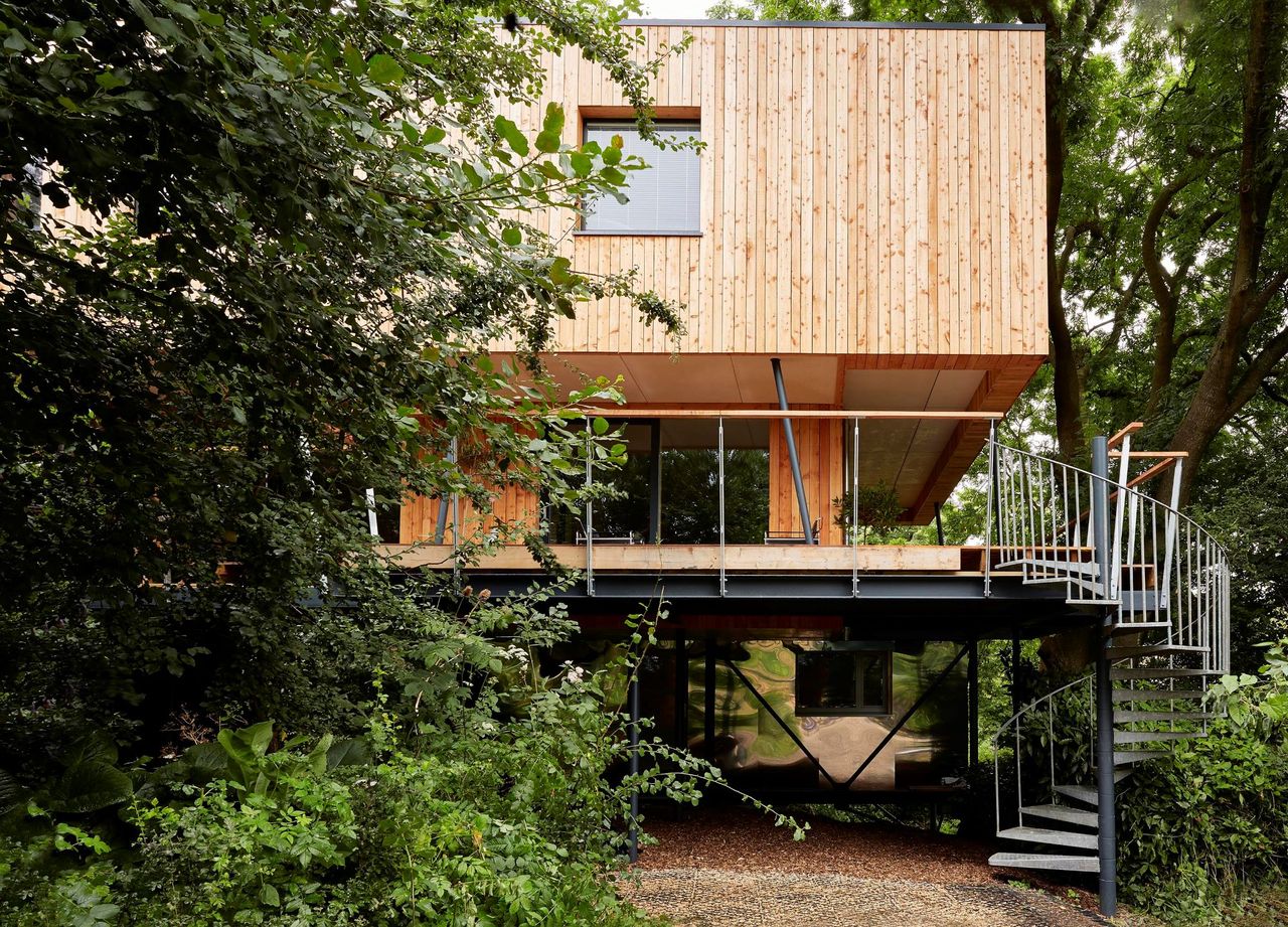 The Gloucestershire-based home in the woods has wooden panelled walls and is surrounded by forestry