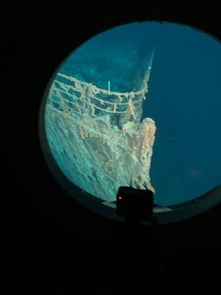 Out the porthole, a view of the Titanic.