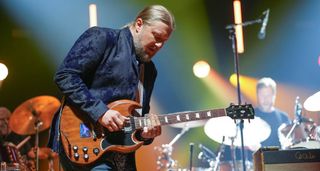 Derek Trucks takes a slide solo on his Gibson SG as Tedeschi Trucks Band performs live at Madison Square Garden.