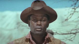 Sidney Poitier with a steely stare in Buck and the Preacher