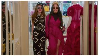 Mimi Morris and Kelly Mi Li, trying on clothes and pretending to walk a catwalk in Mimi's wardrobe in Bling Empire season three