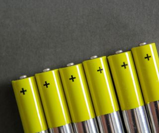 A line of green and silver batteries