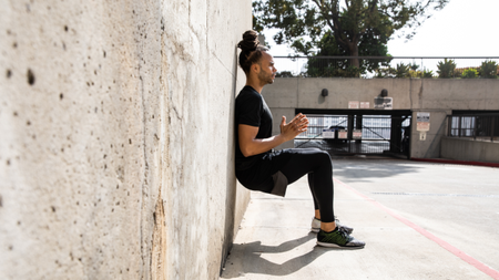 Man doing a wall sit