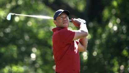 Tiger Woods of the United States tees off on the fourth hole during the final round of the 2024 Masters