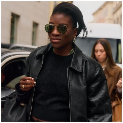 Nikki Ogunnaike wearing a black T-shirt and a leather jacket 