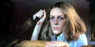 Jamie Lee Curtis holding a knife in the original Halloween