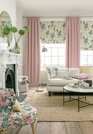 Living room with pink curtains and botanical fabrics by Clarke & Clarke