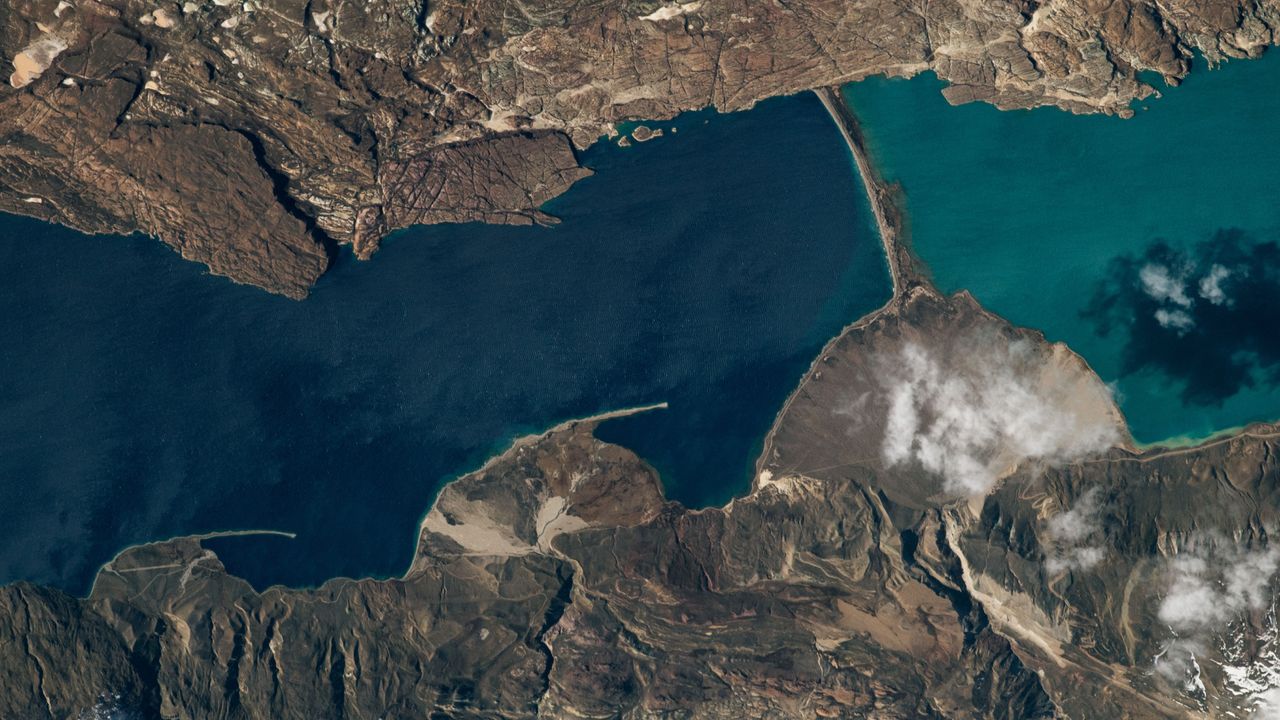 Peculiar land bridge separates a pair of colorful lakes in Patagonia — Earth from space