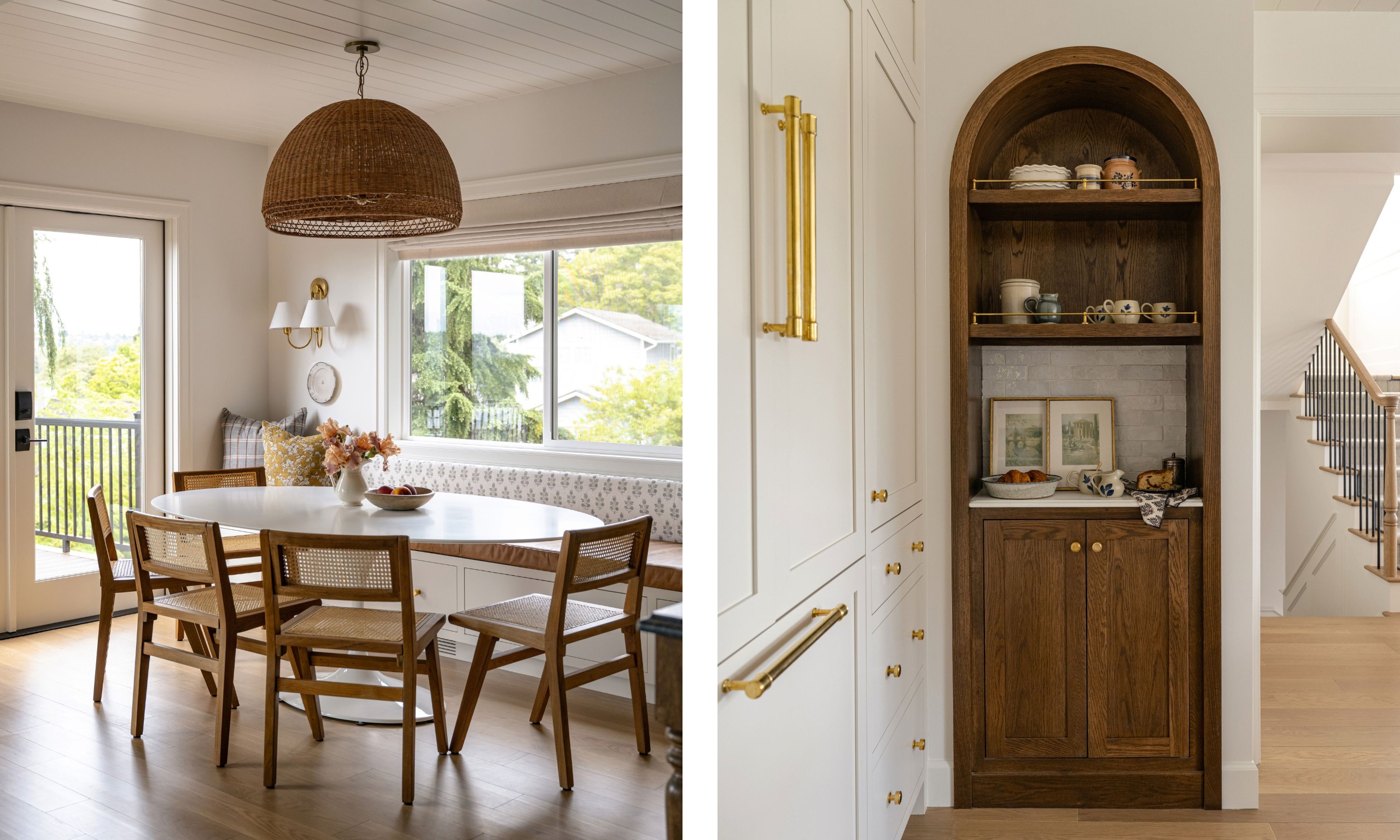 A breakfast nook with dual-aspect windows, wood flooring, and an oval table with wooden chairs. White walls, neutral window blinds, and a banquette seat with patterned upholstery. A dark wood arched coffee nook.