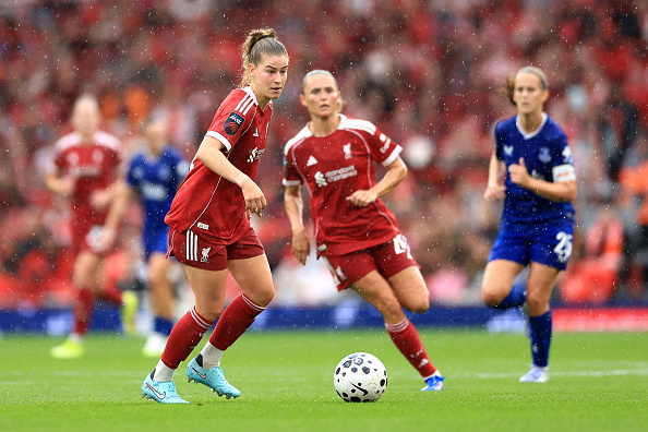 LIVERPOOL, ENGLAND - SEPTEMBER 07: Marie Hoebinger of Liverpool runs with the ball during the Barclays Women's Super League match between Liverpool and Everton at Anfield on September 07, 2025 in Liverpool, England.