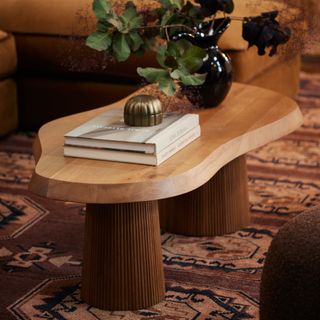 A wooden organic-shaped coffee table from Lulu and Georgia