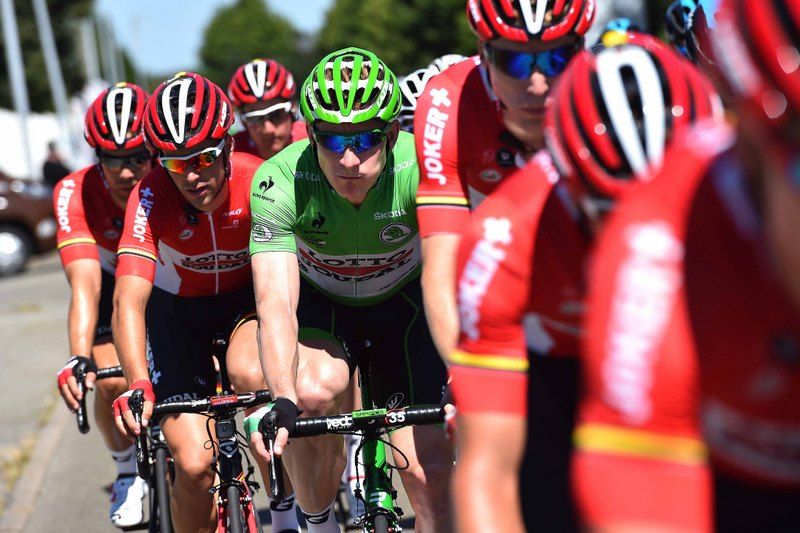 Andre Greipel in green stands out against the red of his Lotto-Soudal teammates