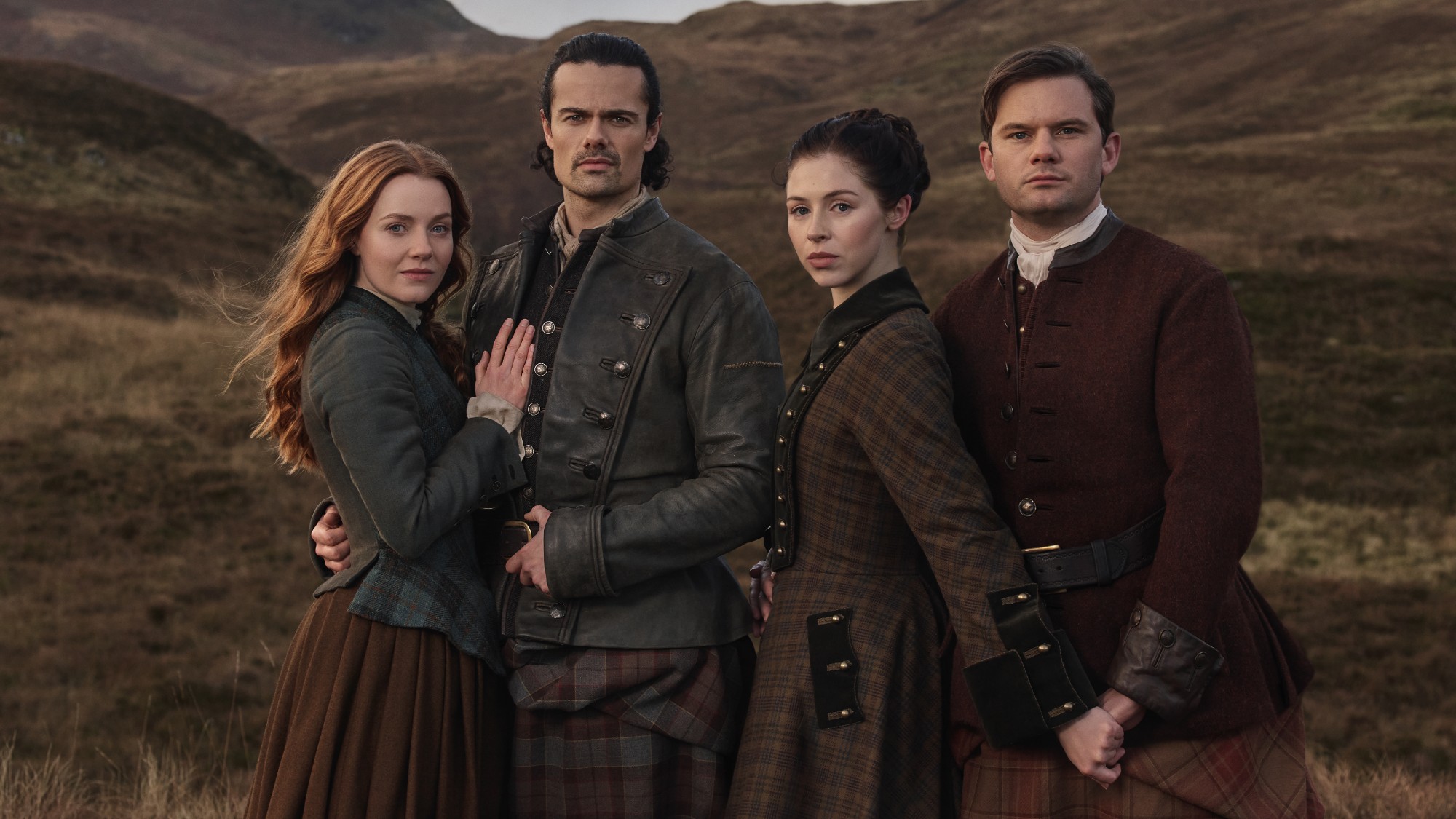 Ellen and Brian standing together and Julia and Henry standing together in Outlander: Blood of My Blood. 