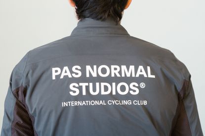 large text on the back of a waterproof jacket