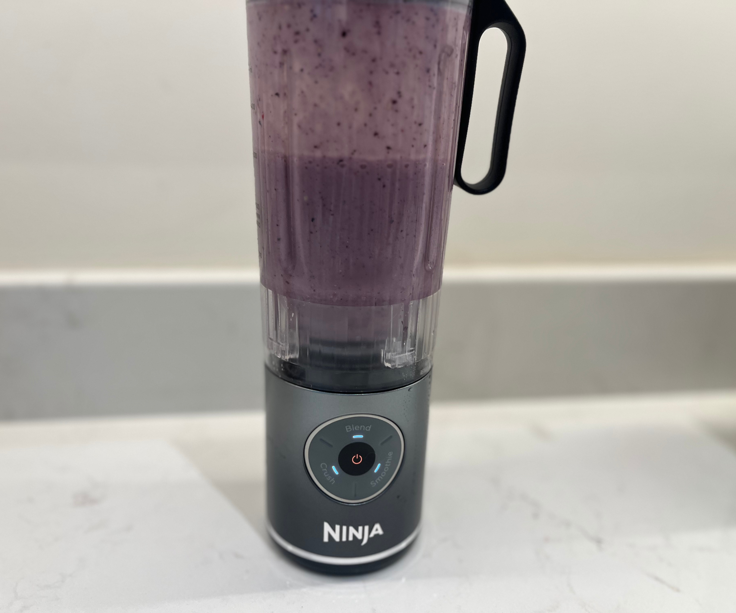 Blending a berry smoothie in the Ninja Blast Max in my test kitchen