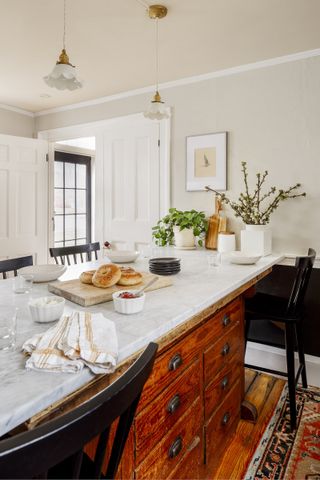 kitchen island with vintage drawers base and marble top