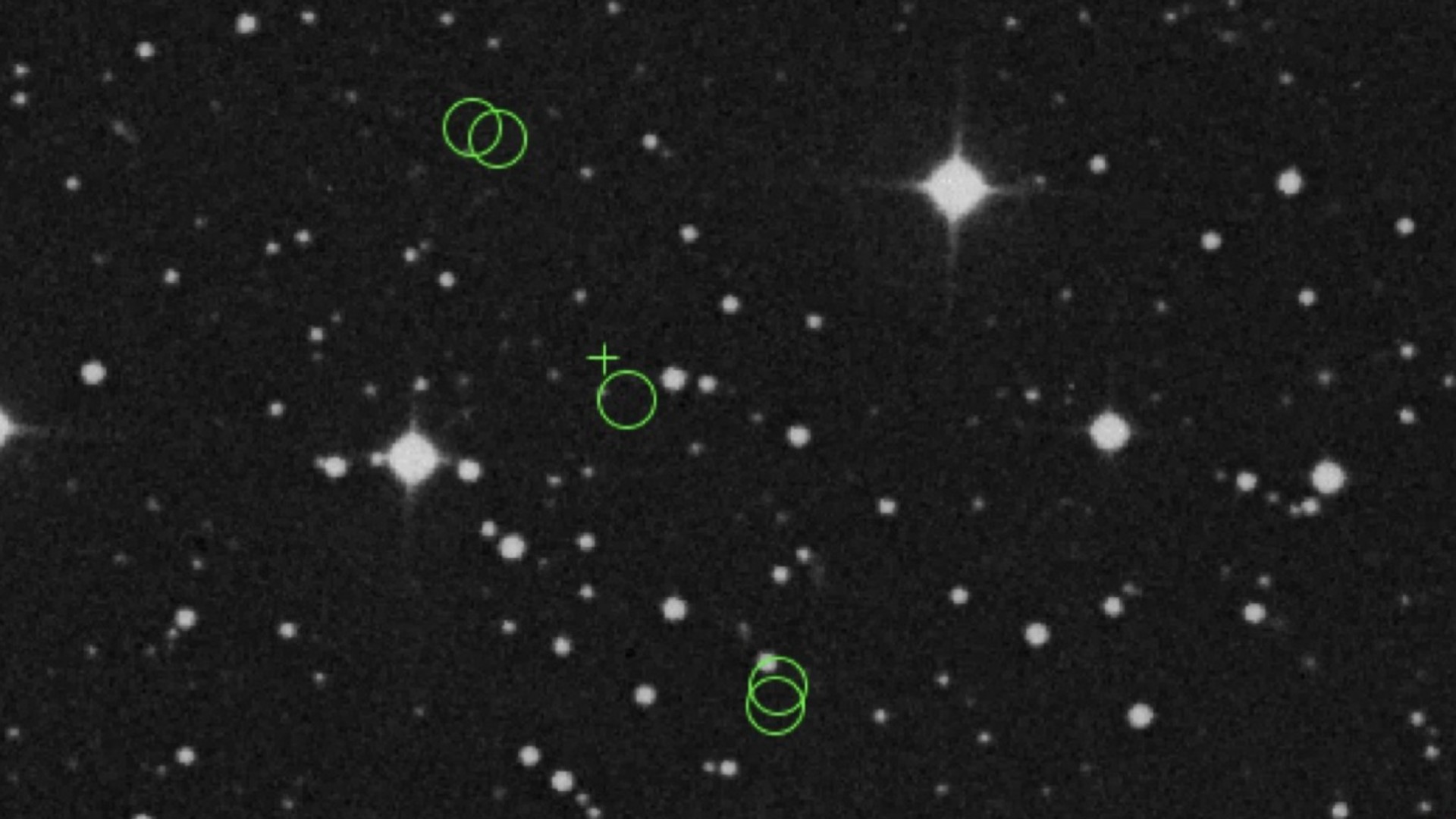 images of stars on a black background, with what appear to be other stars among them circled by dotted lines