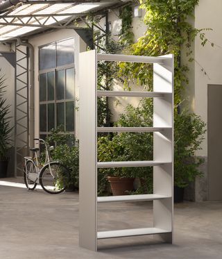 Metal bookcase in a courtyard