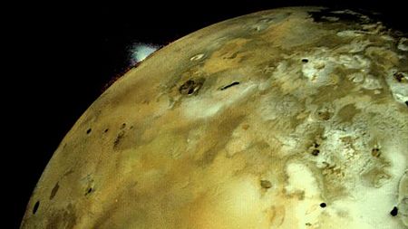 a plume is seen on the horizon of a greenish-yellow and brown moon