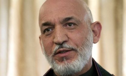 Hamid Karzai says the money his government receives from Iranian officials just helps pay his country's expenses. 