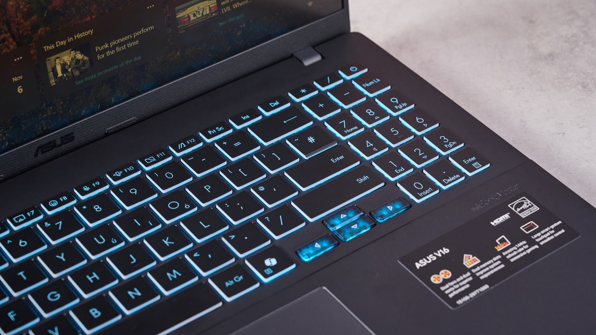 Close-up of right side of keyboard with blue backlighting on Asus V16
