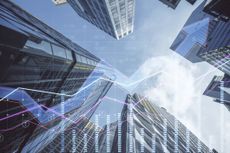 MoneyWeek ETF portfolio: abstract business chart on blurry city backdrop