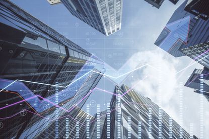 MoneyWeek ETF portfolio: abstract business chart on blurry city backdrop
