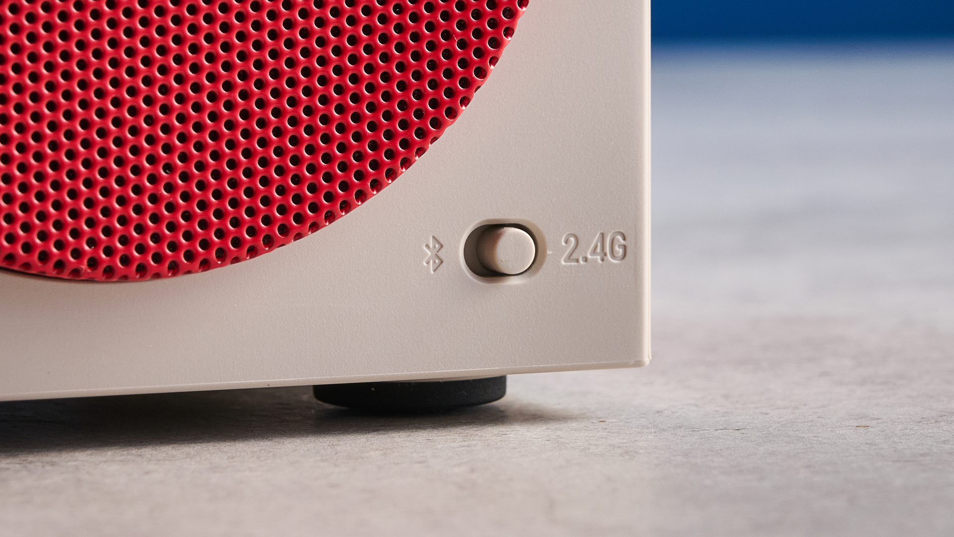 A beige, red and black 8BitDo Retro Cube 2 Bluetooth speaker