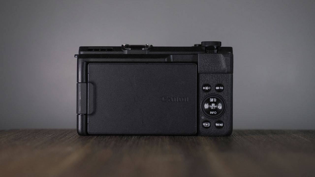 Canon PowerShot V1 on a wooden surface