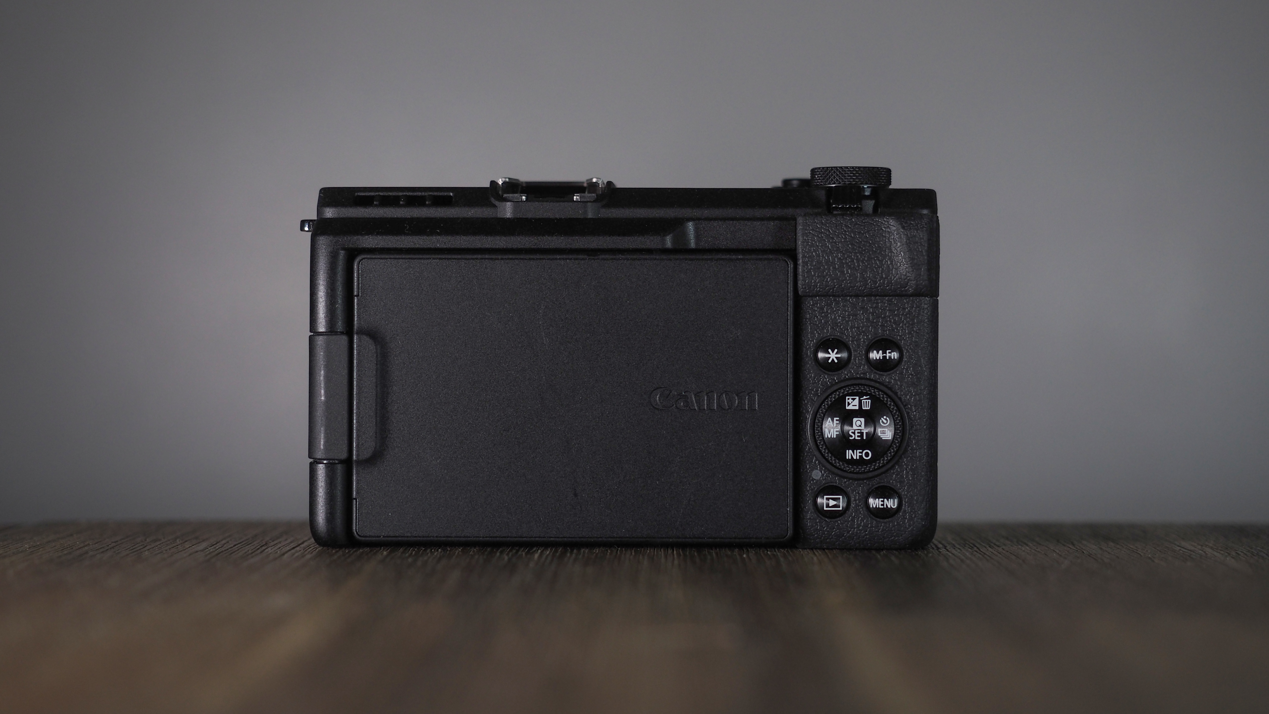 Canon PowerShot V1 on a wooden surface