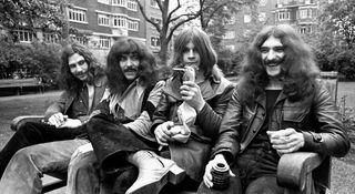 Black Sabbath in 1970 [L-R]: Bill Ward, Tony Iommi, Ozzy Osbourne and Geezer Butler. Ozzy is holding a rubber chicken, much to Geezer's amusement.