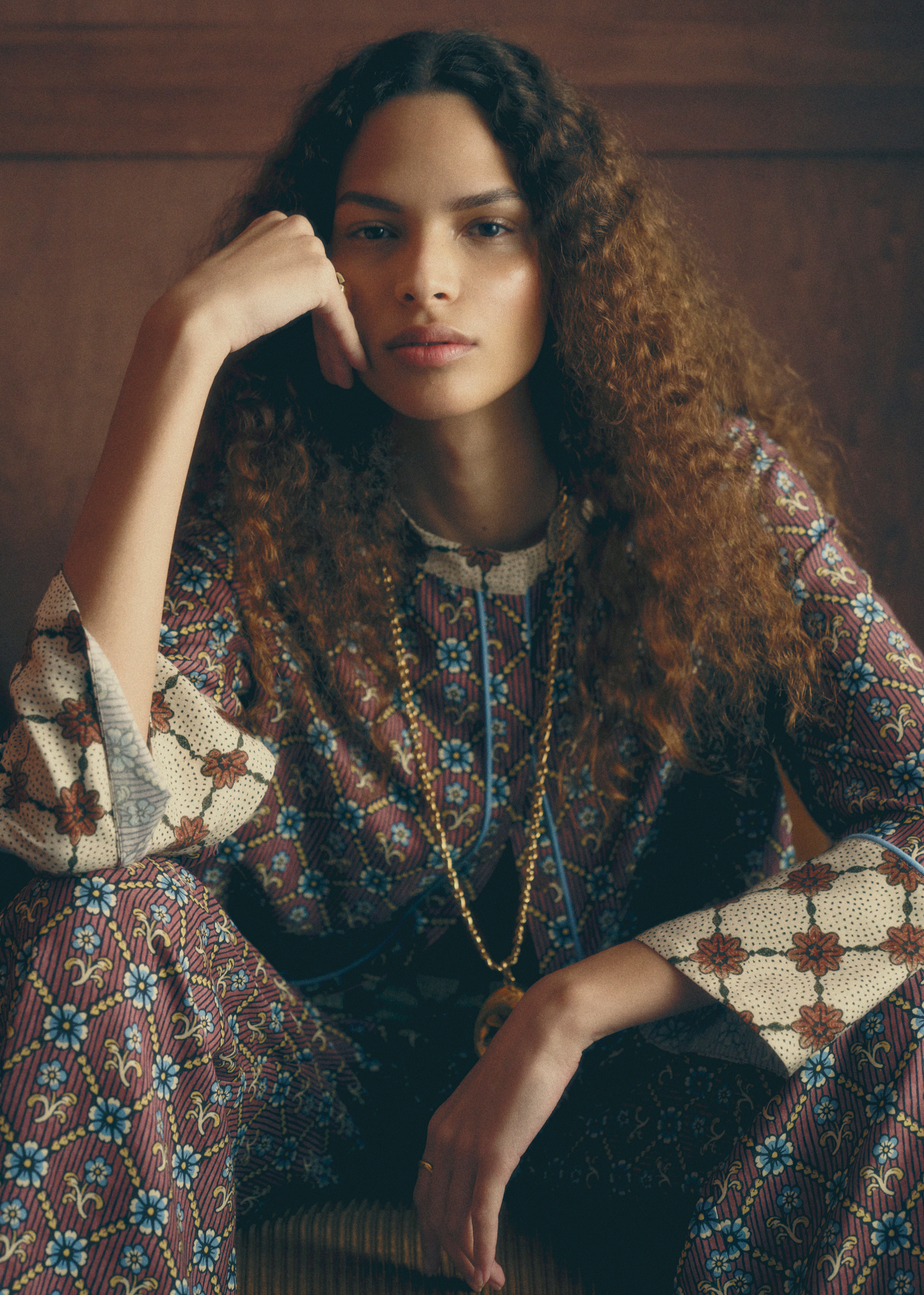 a woman wearing a mixed print set