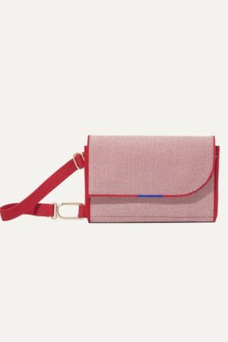 small pink shoulder bag with red detailing