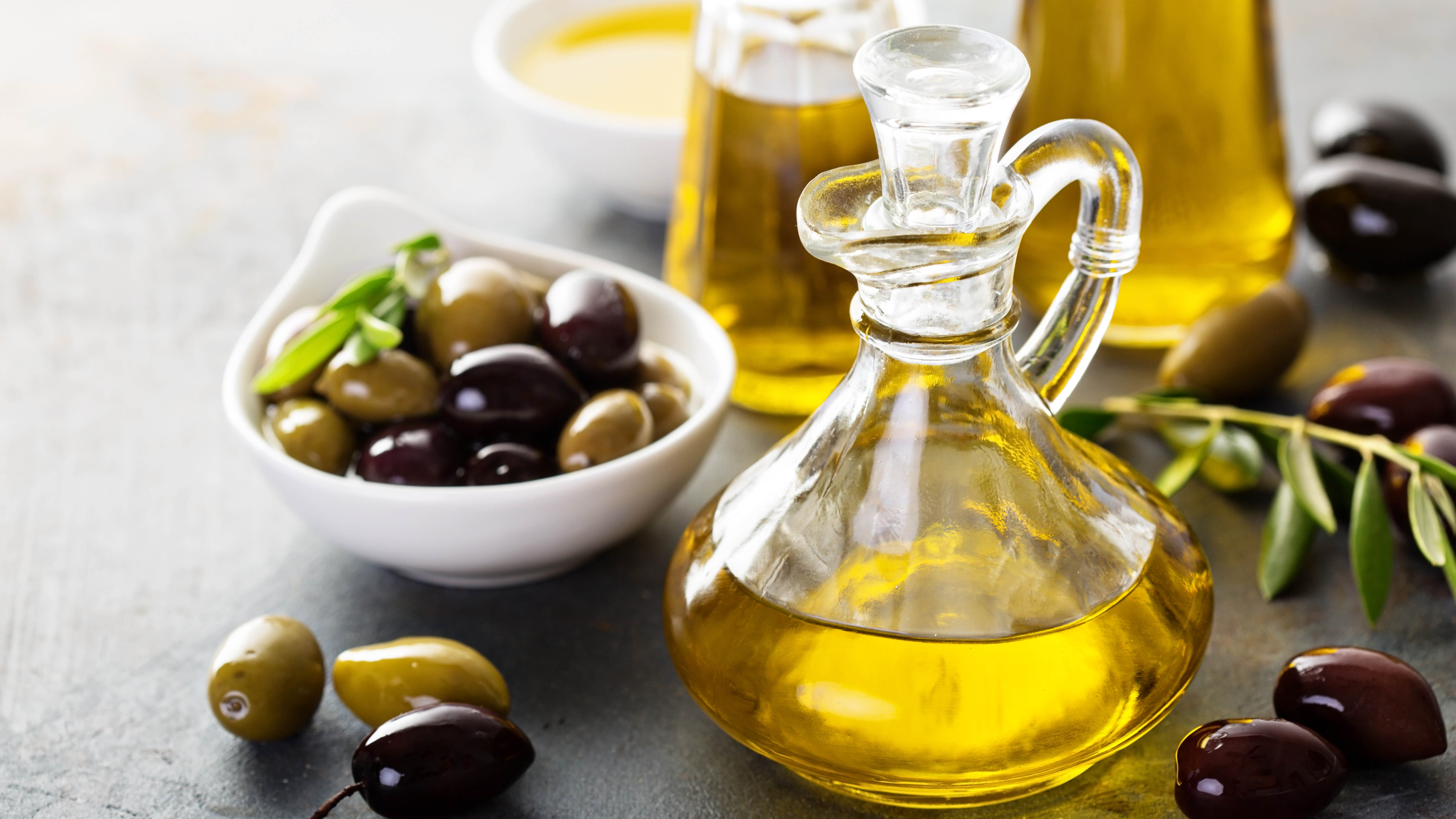 Bottle of olive oil and olives