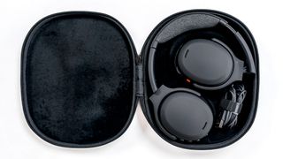 Skullcandy Crusher ANC 2 headphones in open carrying case.