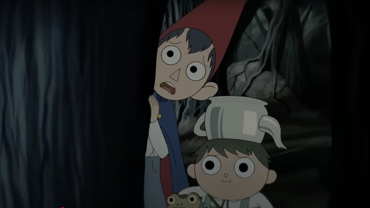 Wirt and Greg looking out from behind a tree nervously.