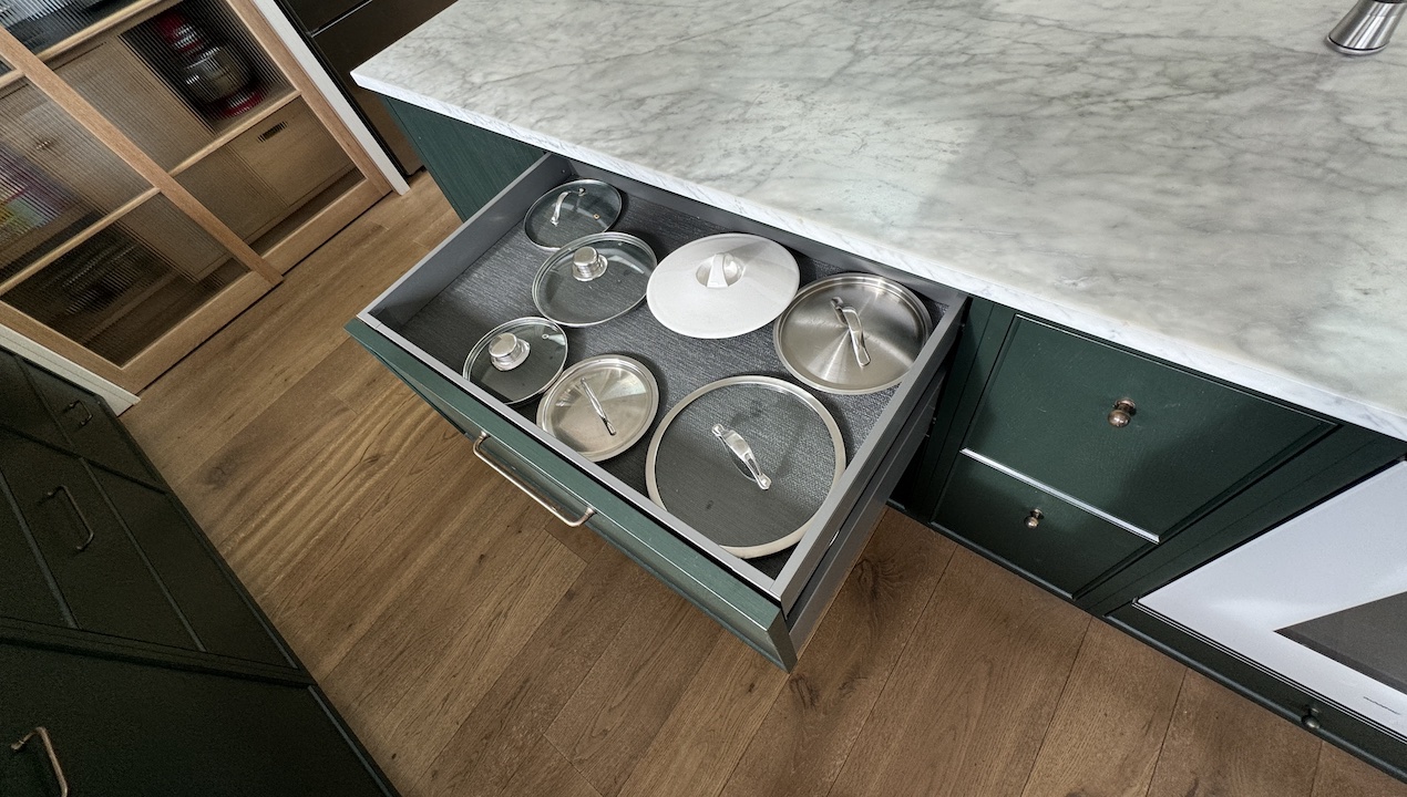 pans lids in a wide drawer