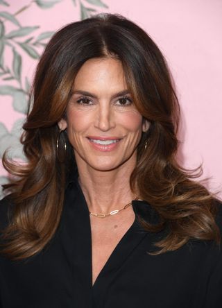 Cindy Crawford with a feathered hairstyle.