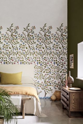 White wallpaper with small trees growing up with plenty of colored plants and leaves