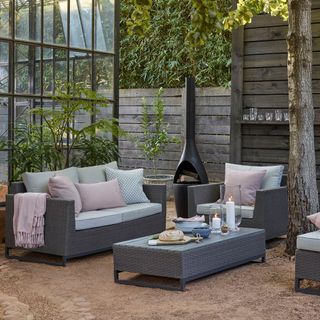 outdoor with candles on table and sofa set with cushion