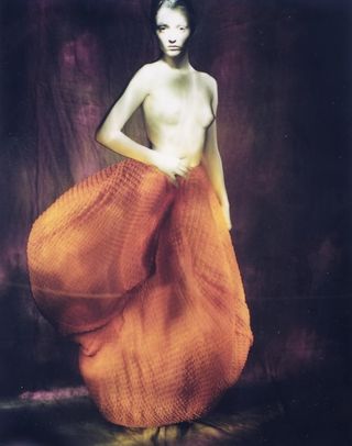 Semi-nude model in fashion photograph from Paolo Roversi exhibition Paris