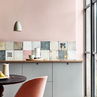 kitchen with pink wall and lamp