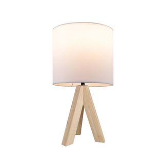 A white lamp with a wooden base