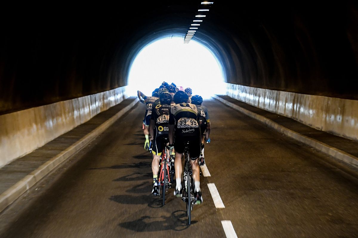 The peloton rides through a tunnel during stage 18 at the Tour de France