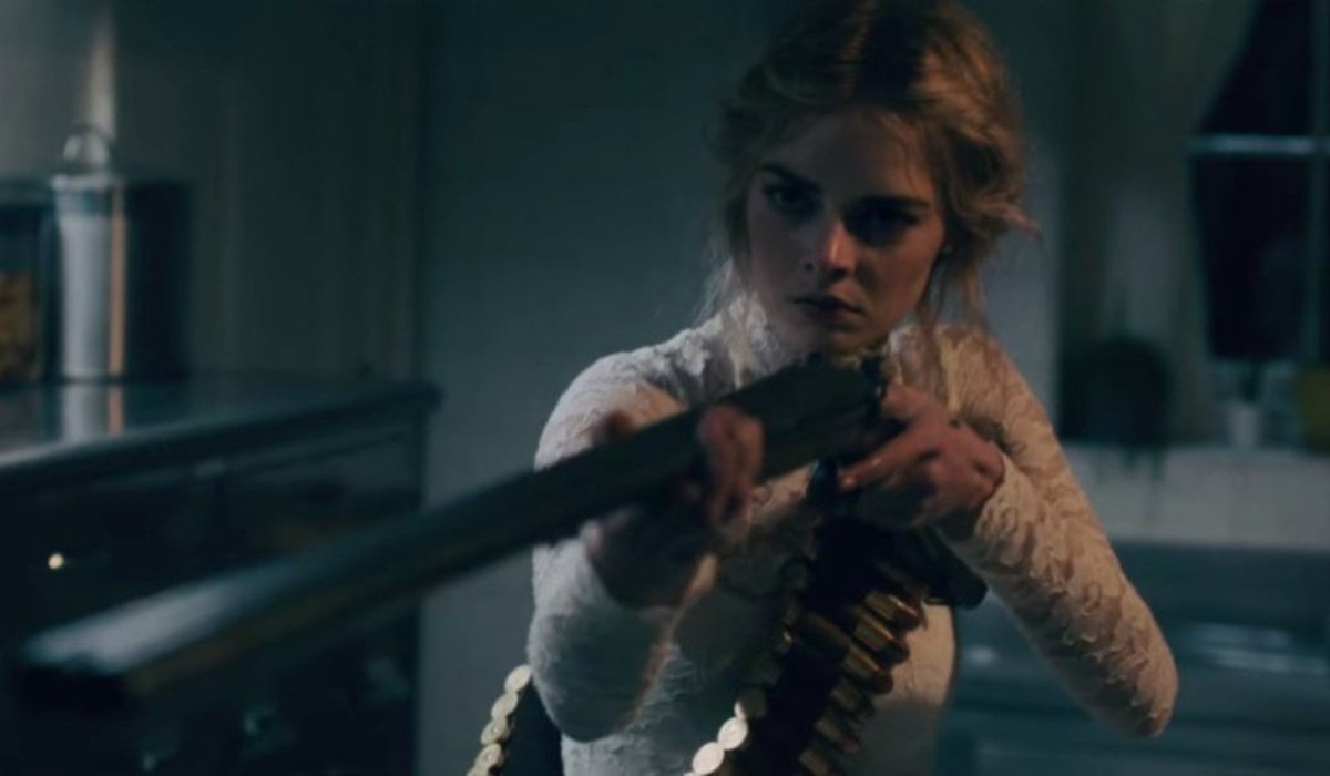 Ready Or Not Samara Weaving aiming a shotgun close to the camera