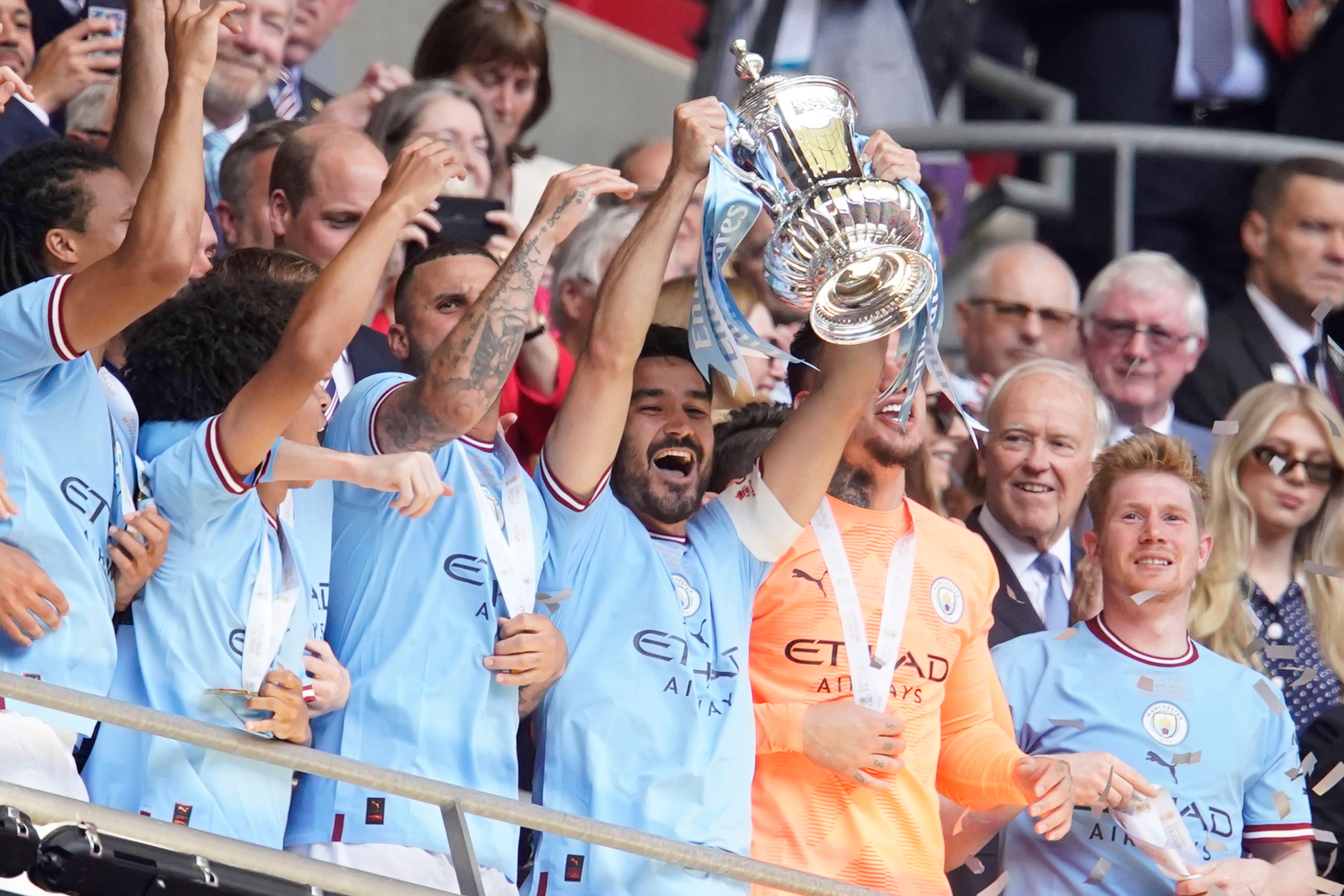 Captain Ilkay Gundogan lifts the FA Cup after Manchester City's victory over Manchester United in the 2023 final at Wembley