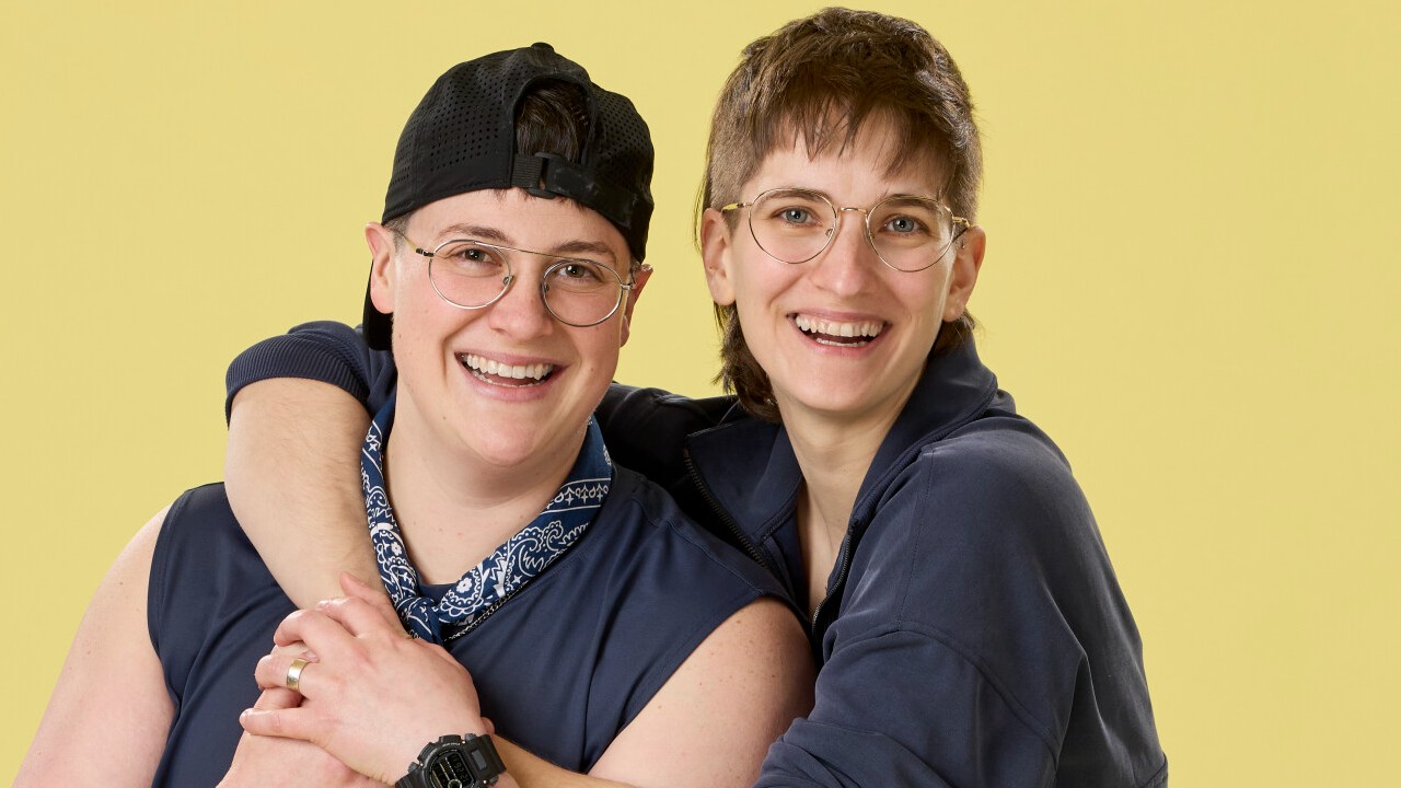 Izzy and Paige posing for their cast photo on The Amazing Race