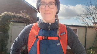 Fitness writer Lily Canter wearing the Patagonia Altvia Daypack showing the front straps